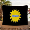 Black flag featuring a yellow sun graphic with the name RICARD printed on it, displayed outdoors.