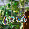 Three hanging crystal suncatchers shaped like flowers in iridescent colors suspended by chains
