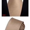 A close-up of a beige silk necktie tied in a four-in-hand knot against a black shirt collar.