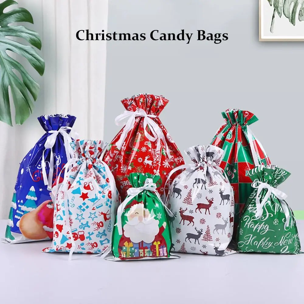 A set of five festive drawstring Christmas candy bags featuring Santa, snowmen, and winter designs in red, blue, and green.