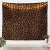 A dark brown leopard print tapestry wall hanging with warm string lights.