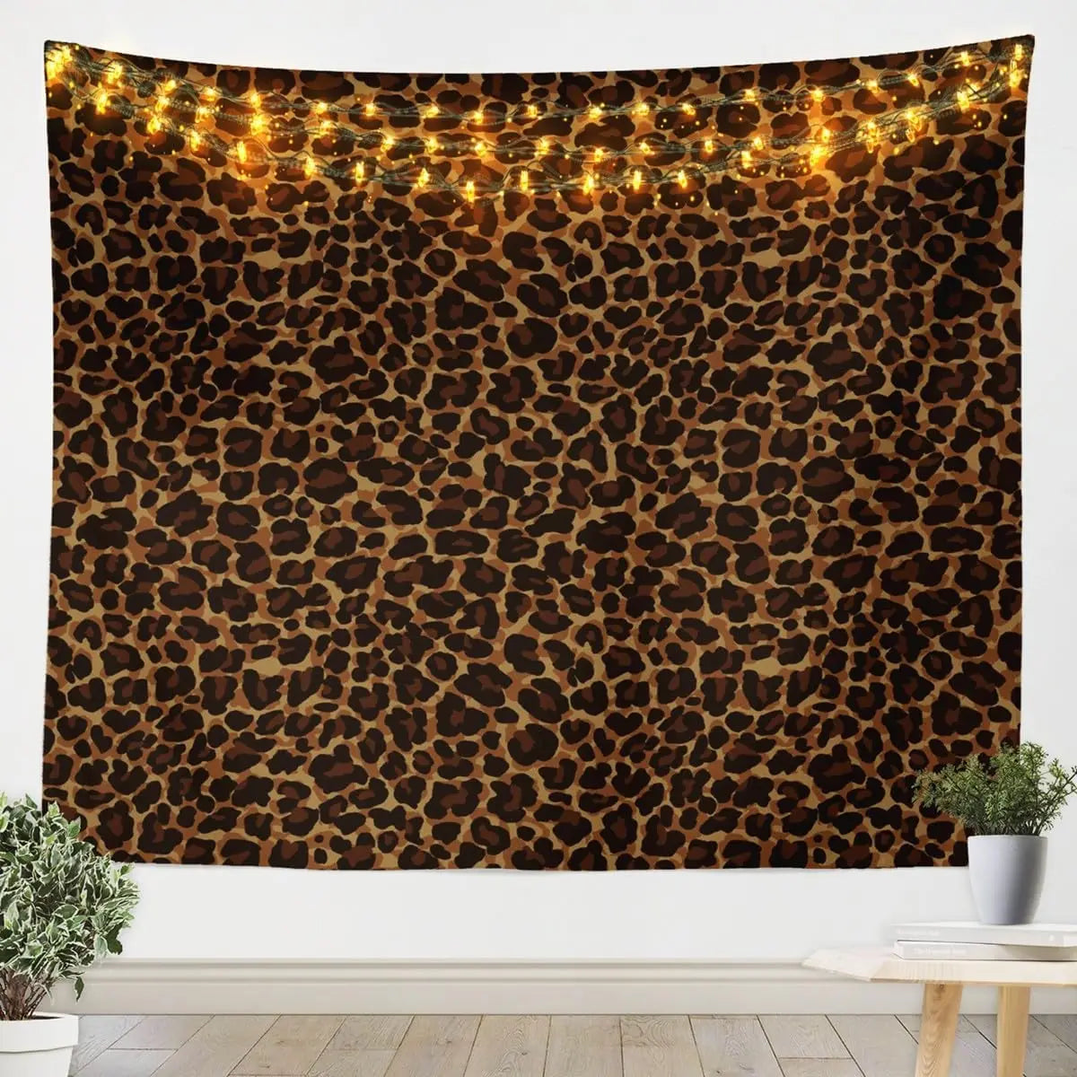 A dark brown leopard print tapestry wall hanging with warm string lights.