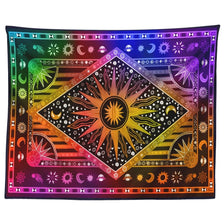 A vibrant bohemian mandala tapestry wall hanging featuring a central sun design surrounded by celestial symbols and colorful 