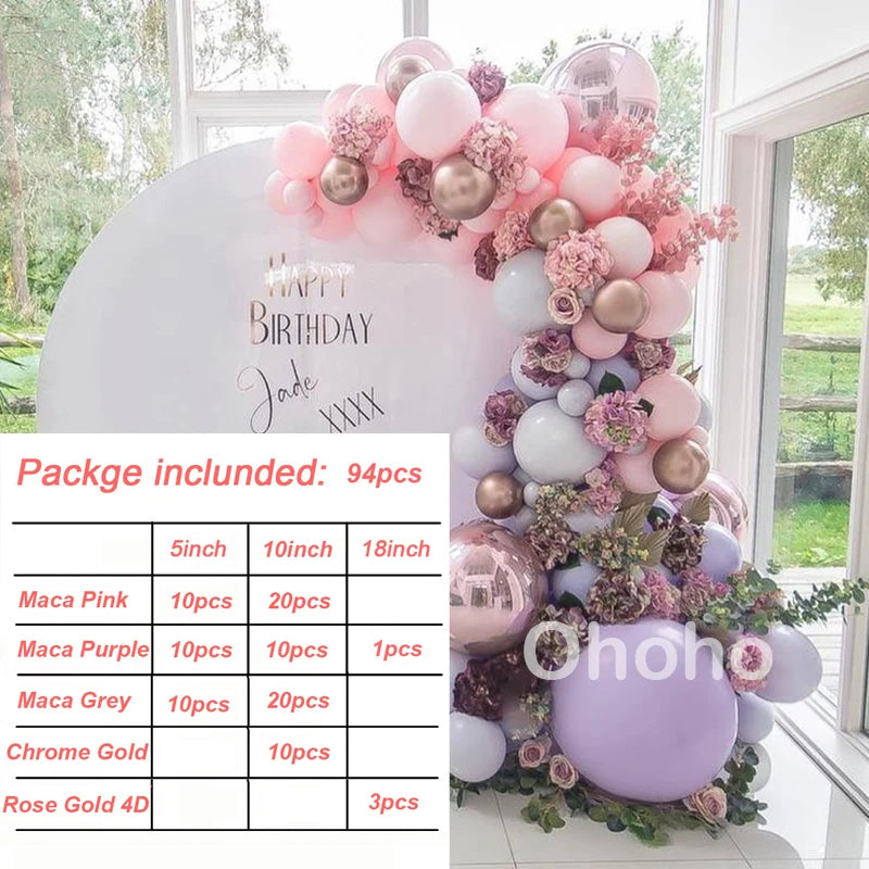 A pink and gold balloon garland featuring various shades of pink, purple, and silver balloons arranged in a vertical display.