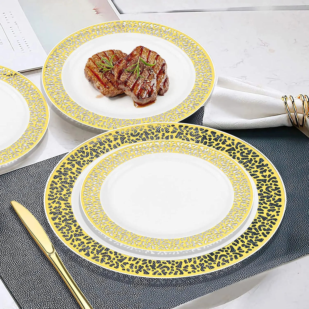A set of elegant gold rim plastic dinner and dessert plates featuring a leopard print design on the rim.