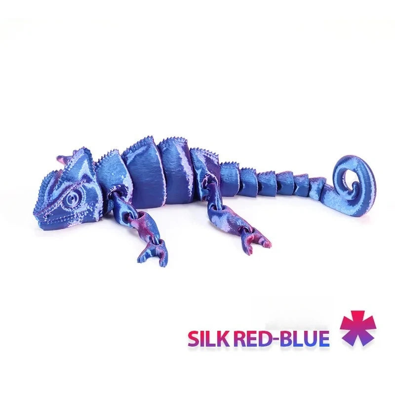 A silicone dragon lizard figurine in silk red-blue color, coiled and detailed.