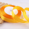 Roll of gold yellow satin ribbon for crafts and gift wrapping