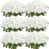 A collection of white artificial silk roses arranged in bouquets.