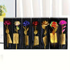 A set of metallic foil rose flowers in various colors displayed in individual black boxes with certificates.