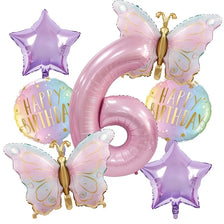 A set of pink butterfly and number balloons forming the number six for a birthday celebration.