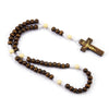 A wooden rosary beads necklace featuring a crucifix pendant.