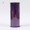 A cylindrical roll of glitter curling ribbon in purple with sparkling accents.