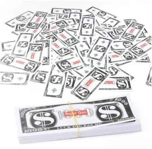 A pile of fake money slips and bills scattered on a white background.