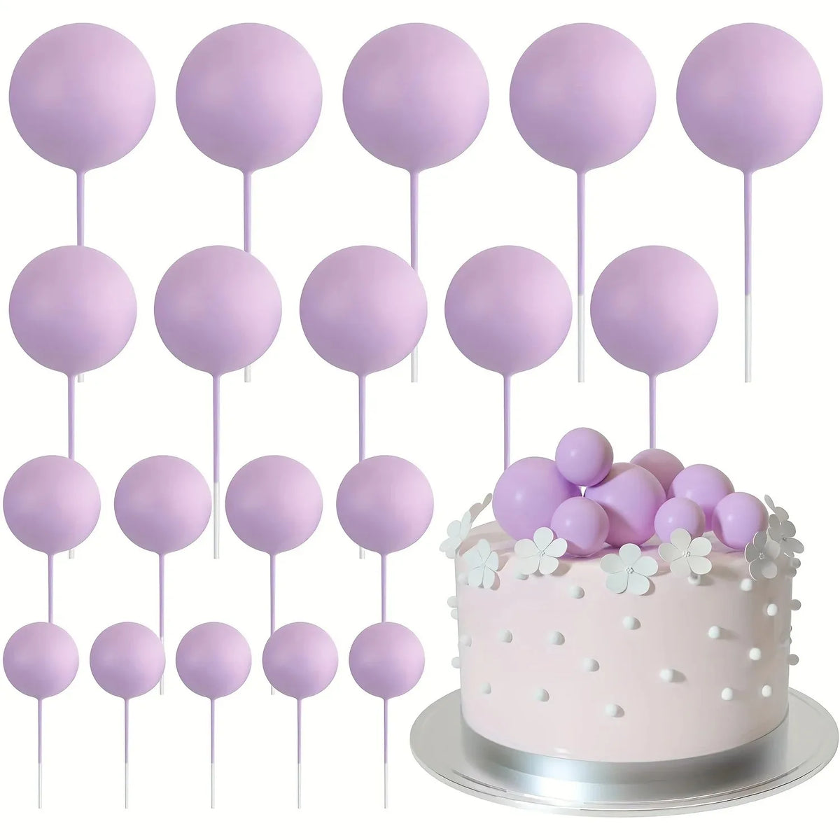 A collection of pink and purple foam ball cake toppers on sticks for party decorations