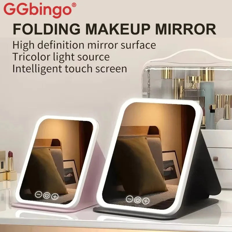 Folding makeup mirror with a light-up screen displayed on a white surface.