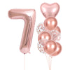 A set of rose gold foil balloons shaped like the number 7 and several heart-shaped balloons for party decor