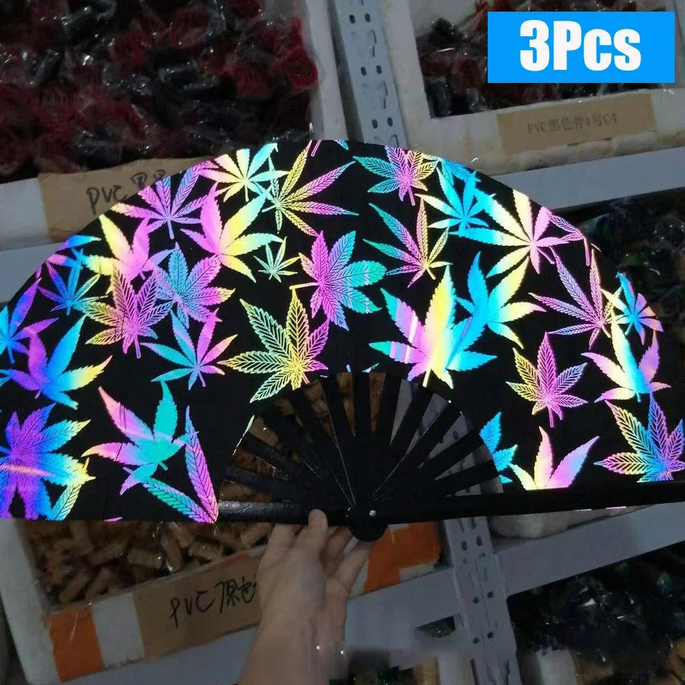 A black folding bamboo hand fan with neon light patterns is displayed against a dark background.