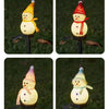 Four variations of solar powered outdoor Christmas snowman lights shown in a garden setting.