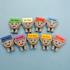 A collection of inspirational motivational stones shaped like bears, each with a colored tag displaying the message You Rock.