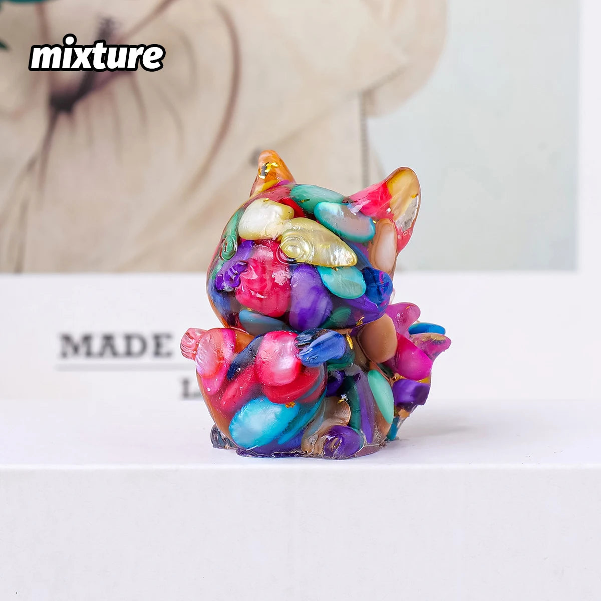 A colorful natural fox crystal sculpture made of various colored stones for Feng Shui decor.