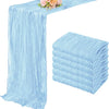 Light blue semi-sheer cheesecloth table runner set with pink floral arrangement