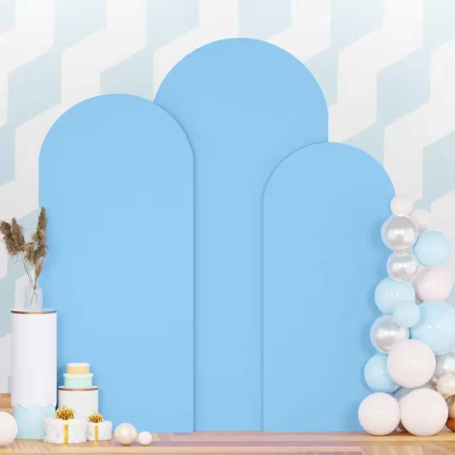 A set of three light blue spandex wedding arch covers displayed against a white and light blue geometric background.