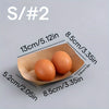 Two brown eggs are placed inside a light brown kraft paper food tray.