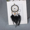A pendant featuring a dream catcher design with a crystal mirror and feathers hanging from a chain.