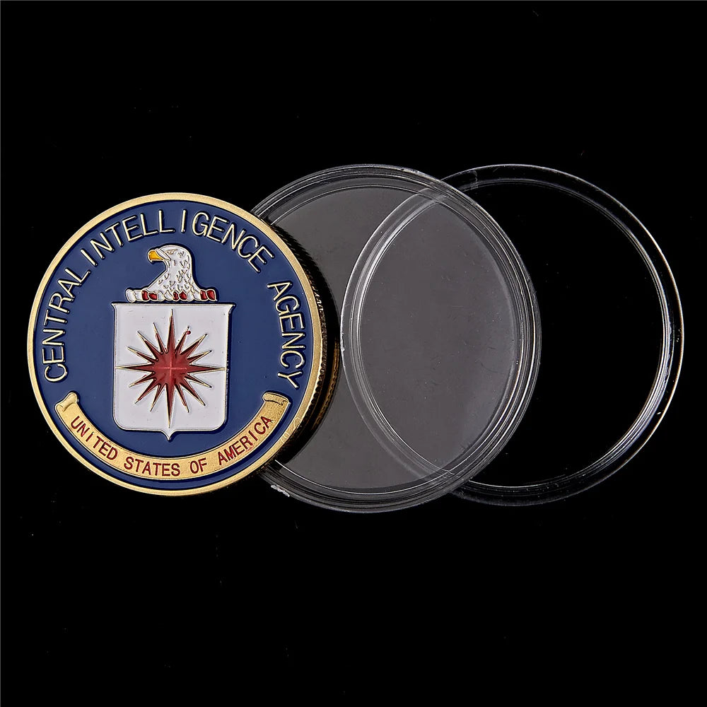 Gold-plated CIA challenge coin with a eagle design and protective clear plastic case