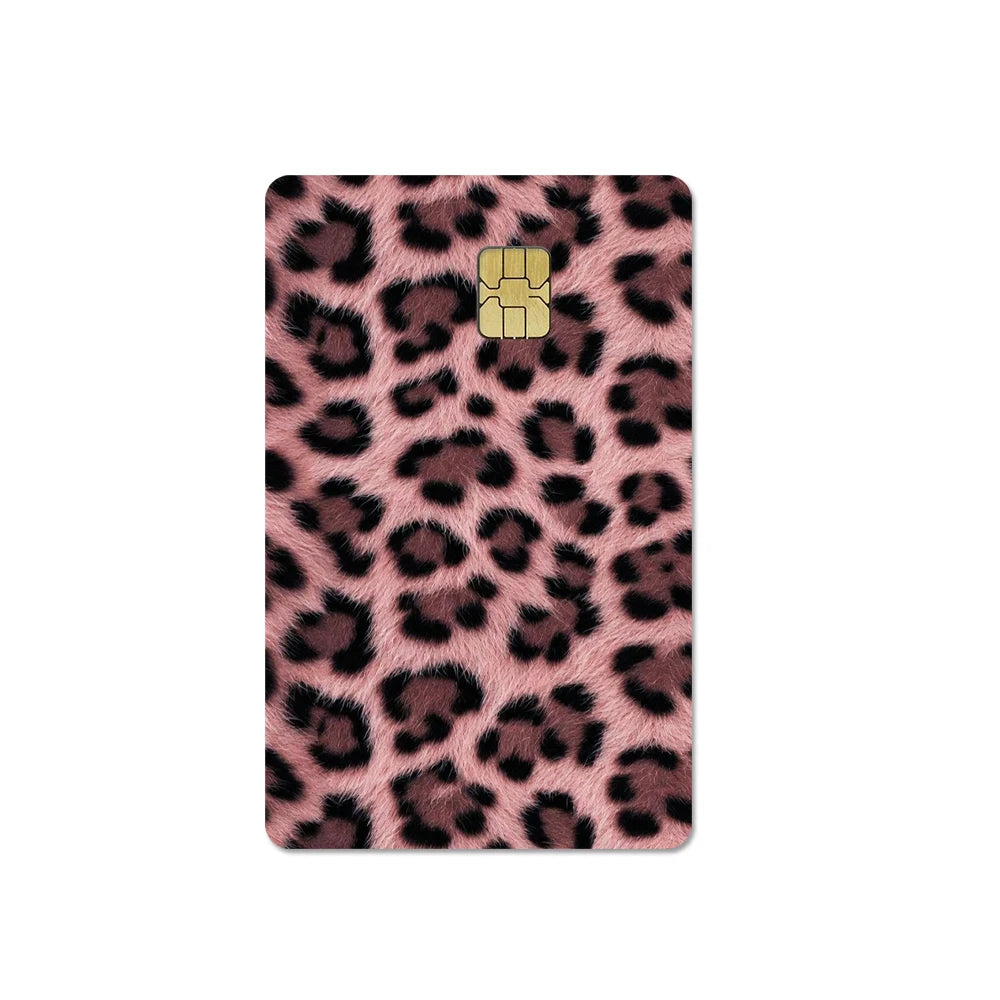A close-up of a card cover featuring a brown and black leopard print design with a gold embossed logo.