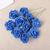 A cluster of twenty vibrant blue foam rose blooms on a beige fabric background.