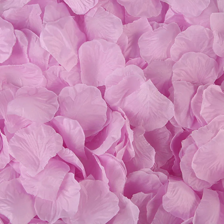 A close-up of pink artificial silk rose petals piled together.