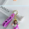 A silicone keychain featuring a Jesus figure and a pink strap, displayed next to the word Bubble.