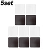 A set of five square acrylic fridge magnets in white and black.