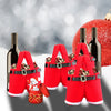 A set of six festive red Santa Claus gift bags with gold buckles and Christmas ornaments displayed against a blurred backgrou