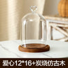 Glass aromatherapy candle holder with a clear dome and wooden base for dust-proof use