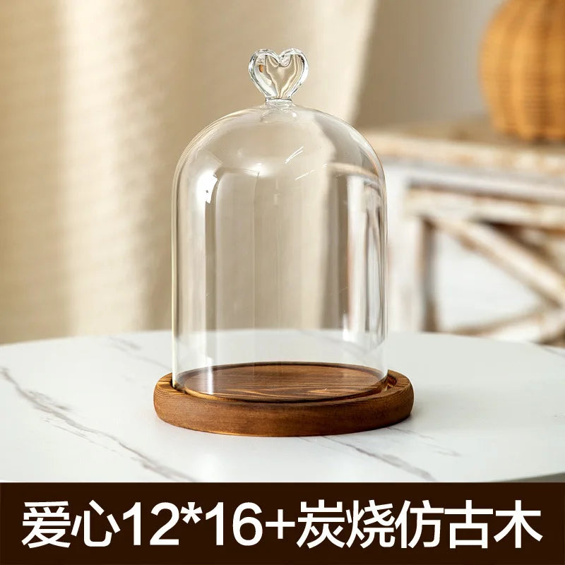 Glass aromatherapy candle holder with a clear dome and wooden base for dust-proof use