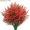 A bouquet of bright orange artificial lavender stems used for outdoor decoration.