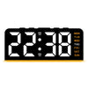 A black digital alarm clock displaying 22:38 with a seven-day display on the right side.