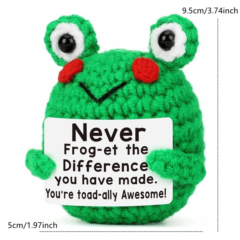 A handcrafted green frog crochet doll with a positive message card that reads Never Frog-et the Difference you have made You'