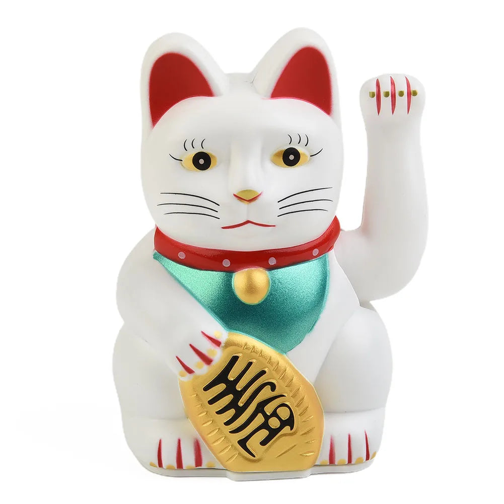 A white ceramic figurine of a cat with red ears, wearing a red collar and holding a gold coin.