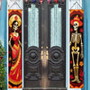 A pair of dark wooden doors decorated with Day of the Dead banners featuring Mexican skulls and floral motifs.