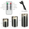 A set of USB rechargeable flameless LED pillar candles with a remote and timer, shown next to the control panel and candle ho