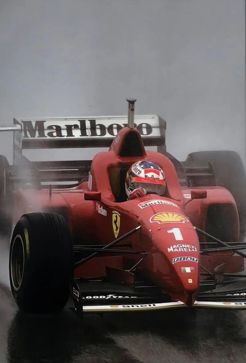 A red Formula 1 racing car is visible in a misty environment.
