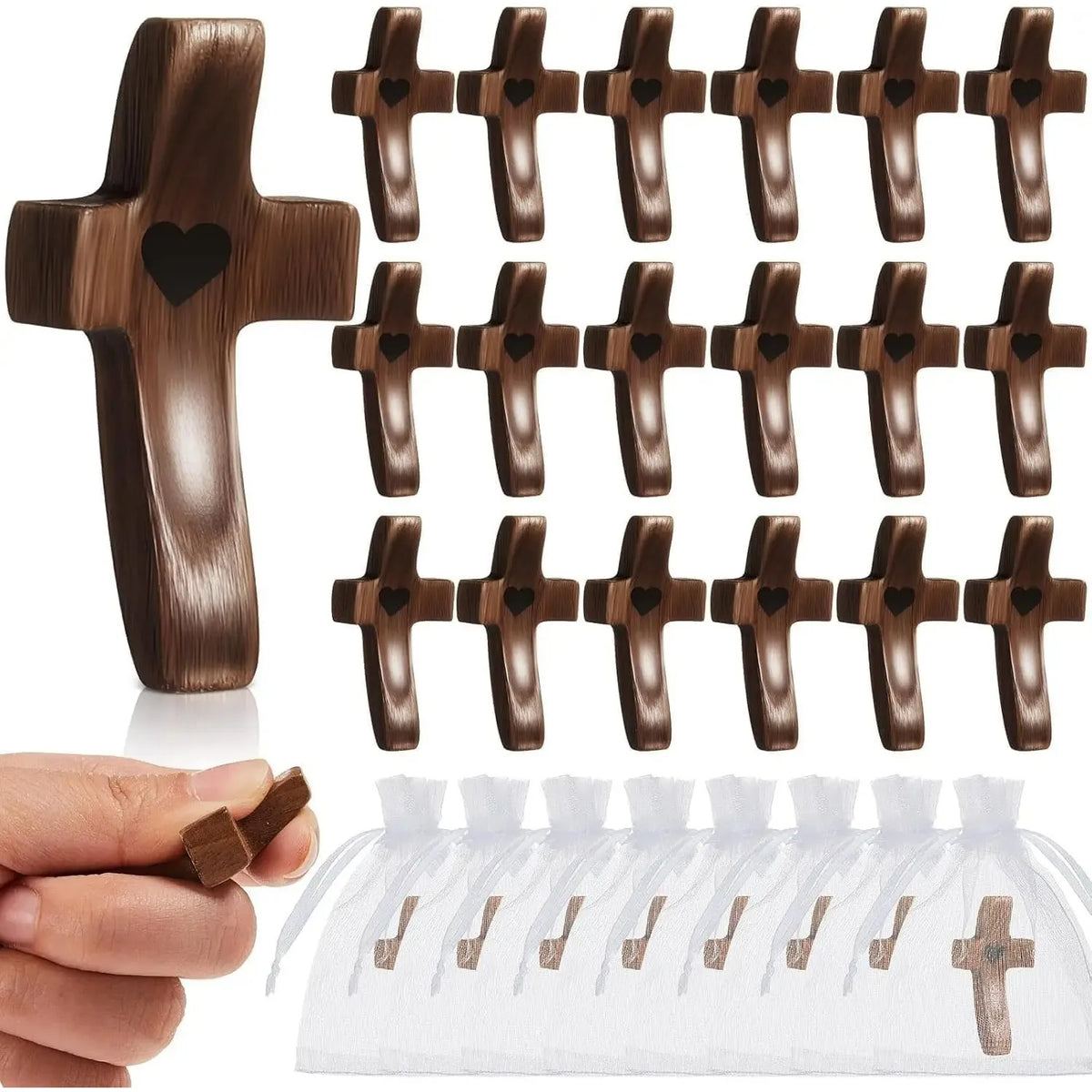 A set of handcrafted black walnut crosses for prayer and meditation displayed on a white cloth.
