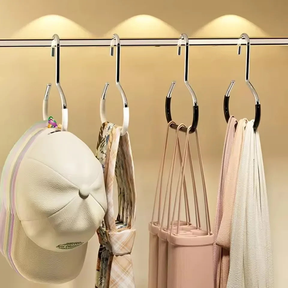 A display of circle ring hat hangers hanging from a bar, showing various hats and accessories.