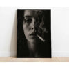 A black and white portrait of a woman with smoke curling from her lips, displayed on canvas.