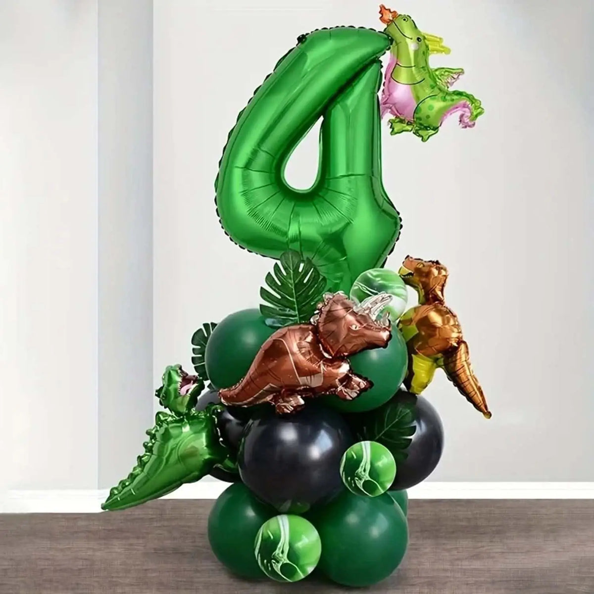 A green balloon set featuring a large number four and various dinosaur-themed balloons.