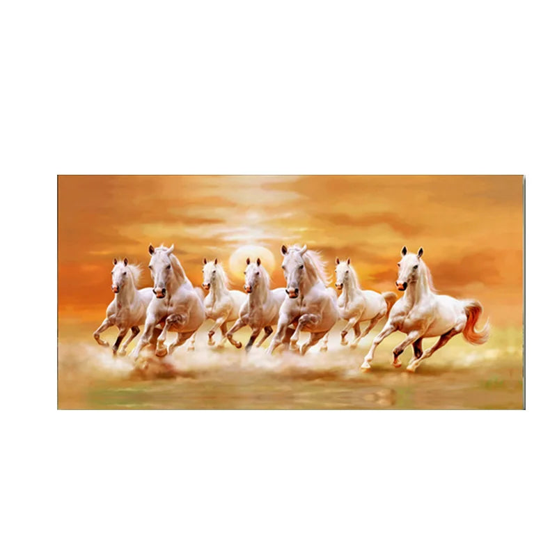A group of white horses galloping across a golden sunset landscape.