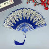 A blue and silver folding fan with intricate traditional Chinese floral design.